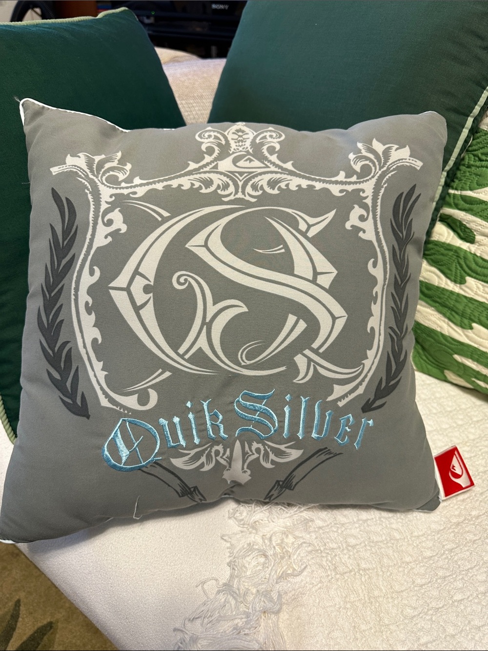 Collectible Quiksilver Gray Pillow of vintage 2000s surf culture merchandise.
